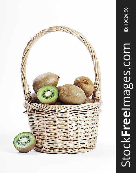 Wicker basket full of fresh juicy kiwi fruits. Wicker basket full of fresh juicy kiwi fruits