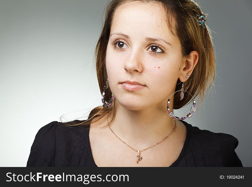 Portrait of elegant beautiful woman wearing jewelry.