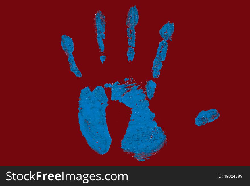 On a photo the hand print on a red background is presented