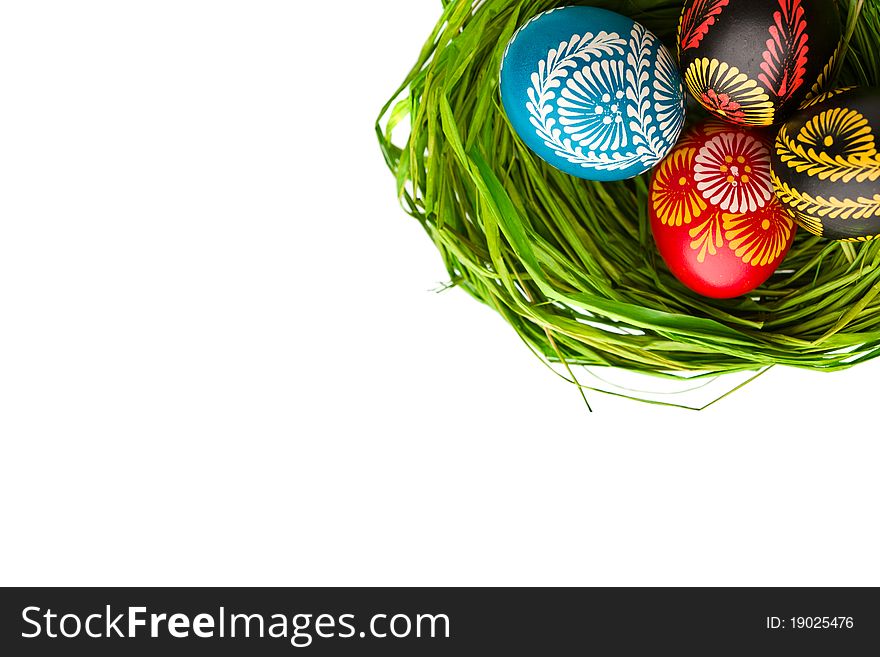 Painted easter eggs in basket on white background. Painted easter eggs in basket on white background