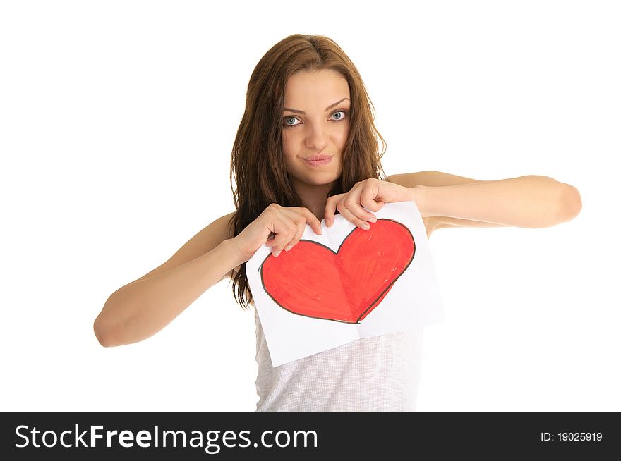 Young woman breaks the painted heart isolated on white