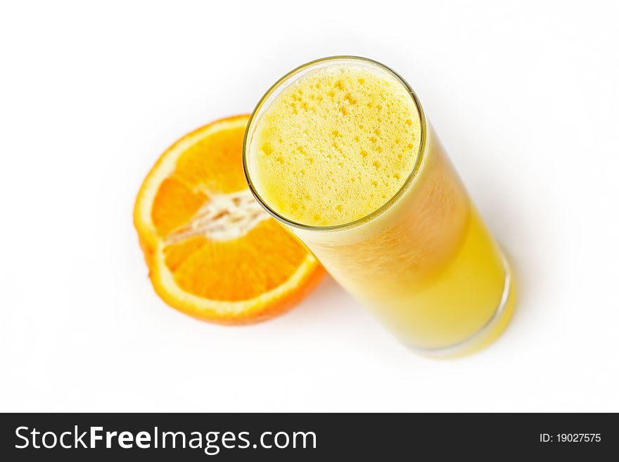 Fresh orange juice and slice on white from above