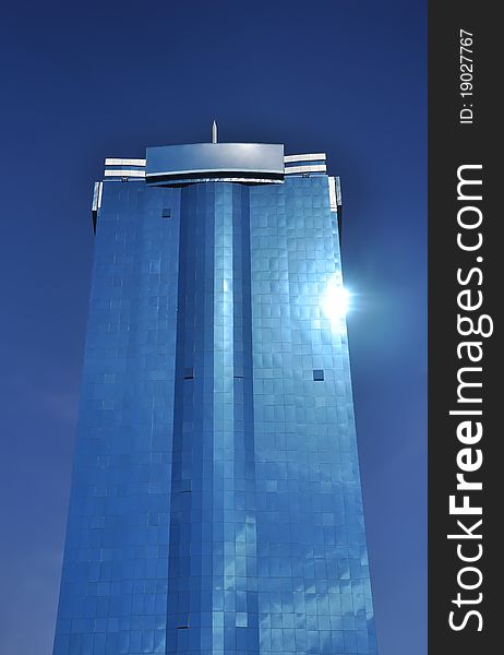 Tall Office Building Against Blue Sky