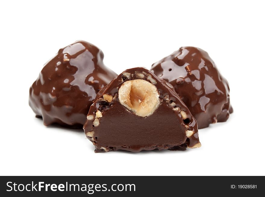 Chocolate candy with nuts isolated on a white background