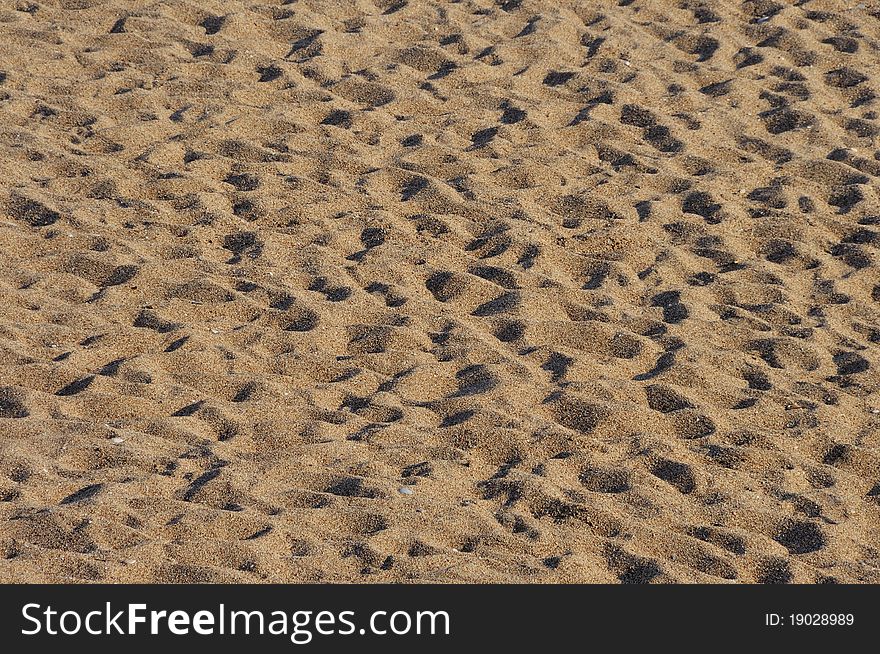 Foot prints in sand on sunset warm light. Foot prints in sand on sunset warm light