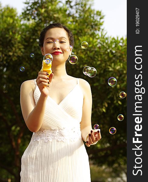 Young woman with soap bubbles