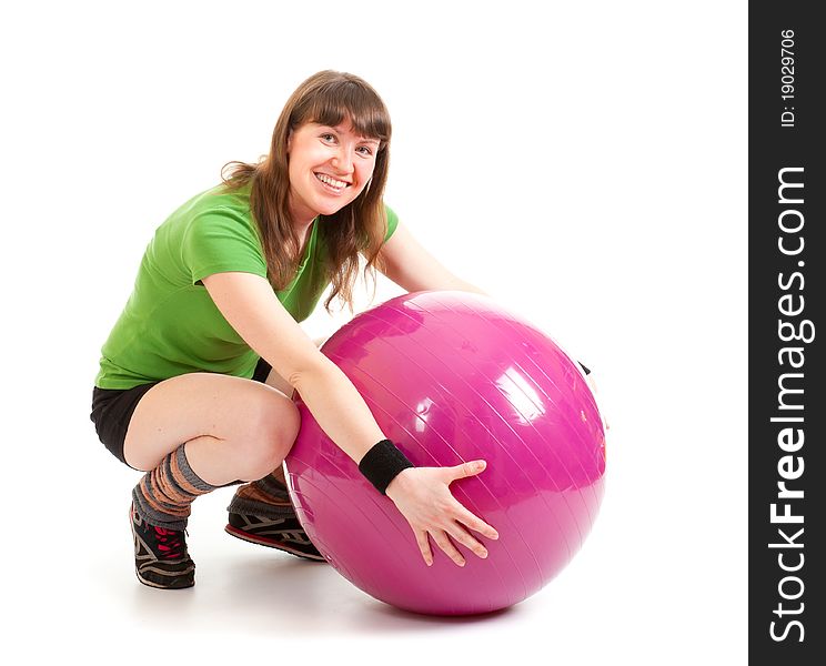 Young nice woman sitting with a big ball. Young nice woman sitting with a big ball