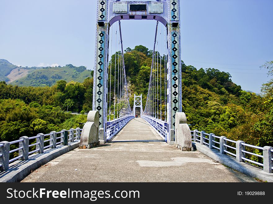 A suspension bridge across mountains
