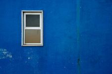 Small Window On Blue Wall Royalty Free Stock Images