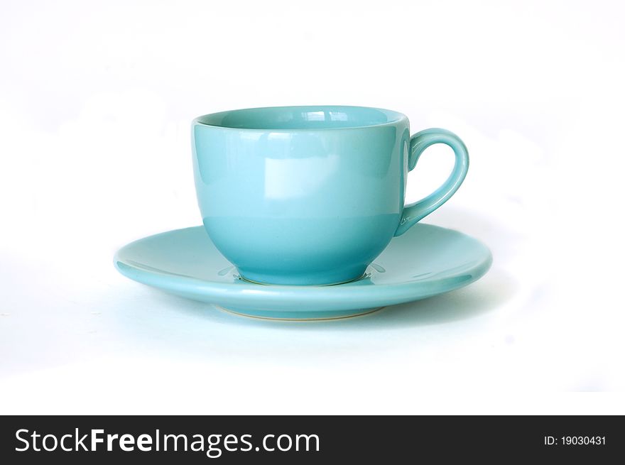 Blue cup and soucer isolated on white