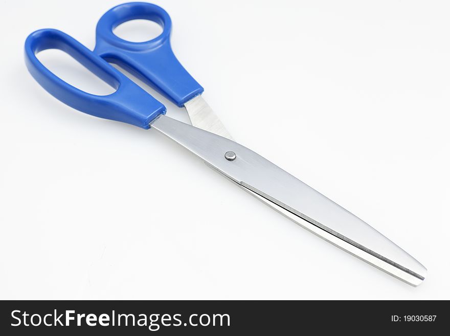 Close up of blue handle scissors on white background. Close up of blue handle scissors on white background