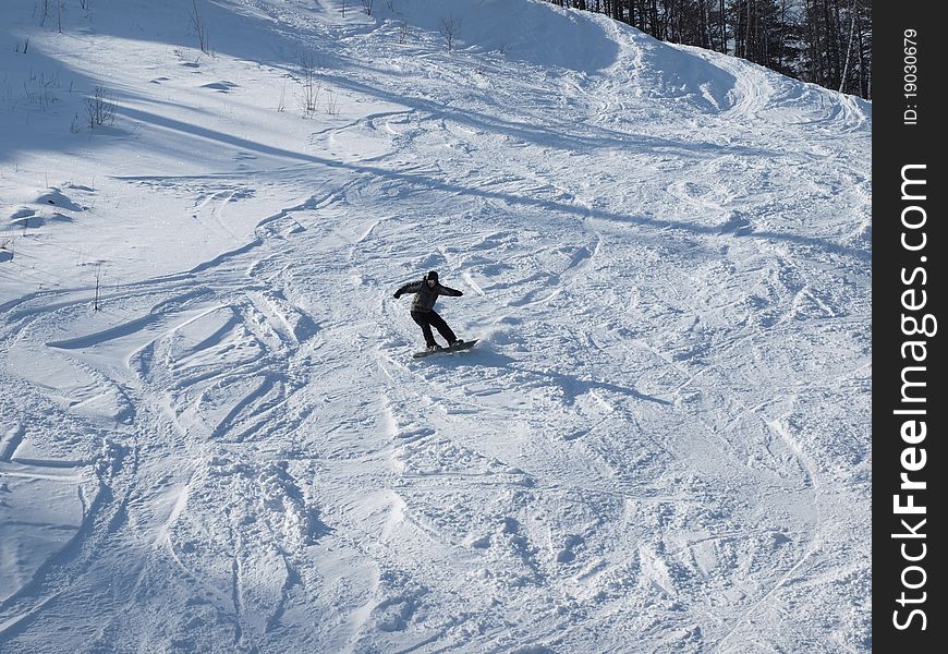 Snowboarder on the mountain slope