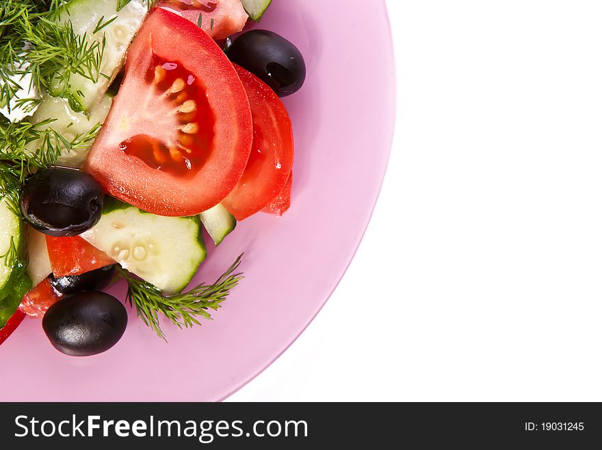 Plate of fresh vagetable salad across white. Plate of fresh vagetable salad across white