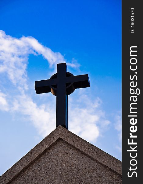 Cross Silhouette Against Blue Sky