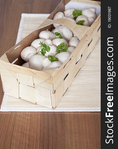 Large mushrooms with parsley in a basket