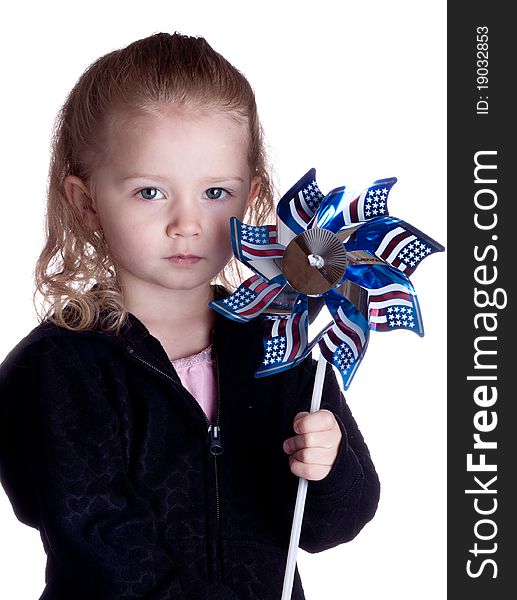 Fourth of July Photograph of a young girl holding an American windmill. Fourth of July Photograph of a young girl holding an American windmill.