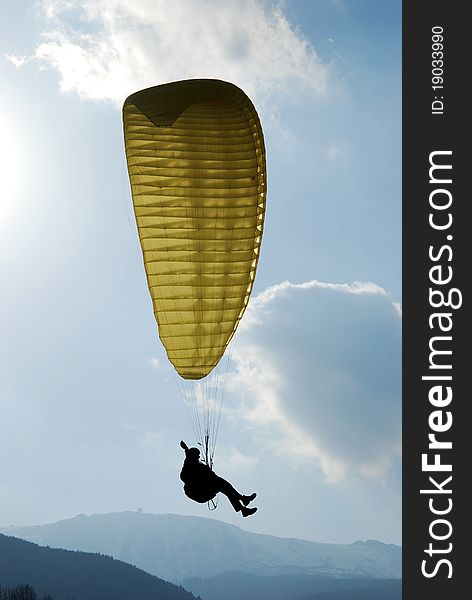 Paraglider, flying over hills and meadows. Paraglider, flying over hills and meadows