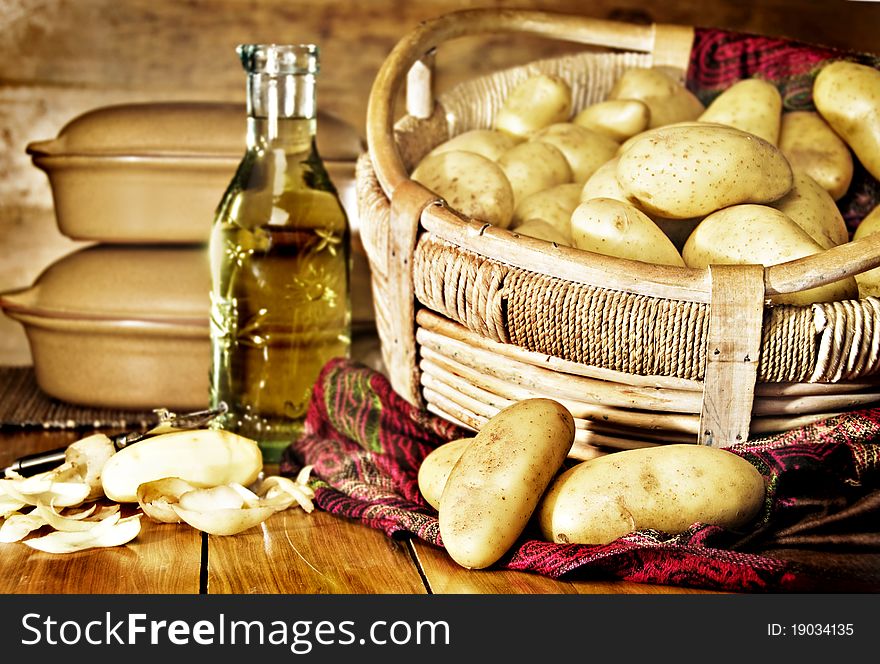 Still life of potatoes in a basket with olive oil