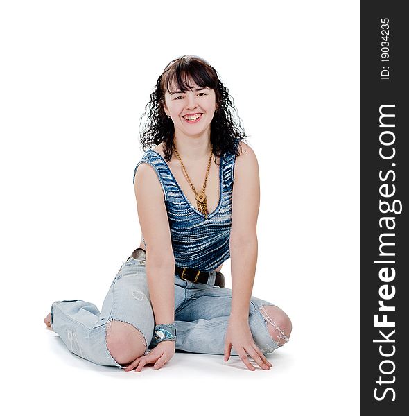 Portrait of smiling girl in torn jeans