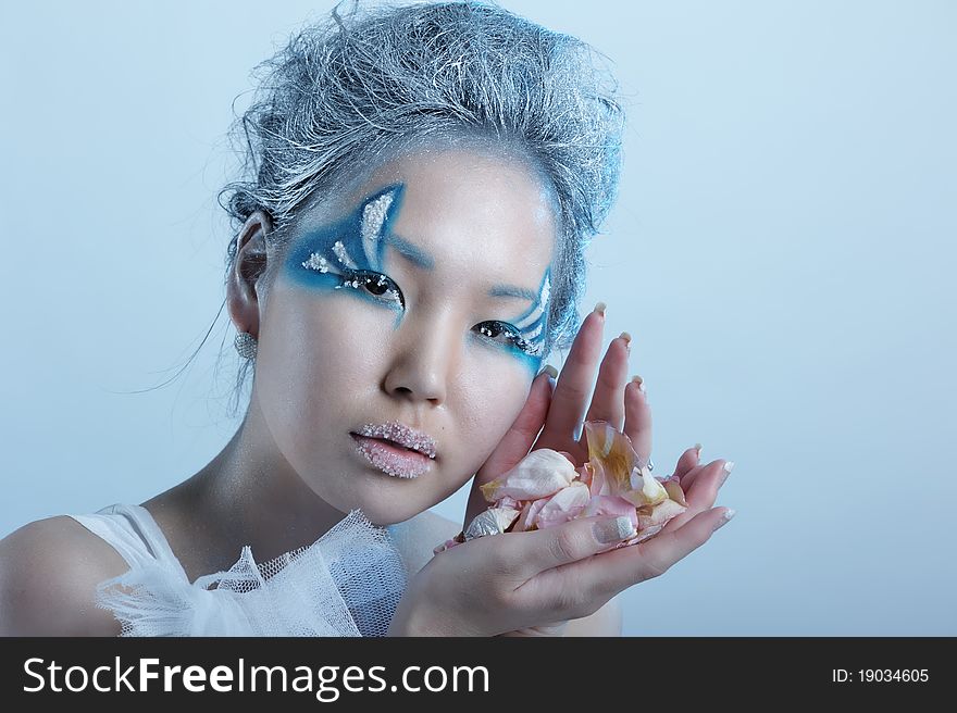 Portrait of woman with creative makeup and flower. Portrait of woman with creative makeup and flower