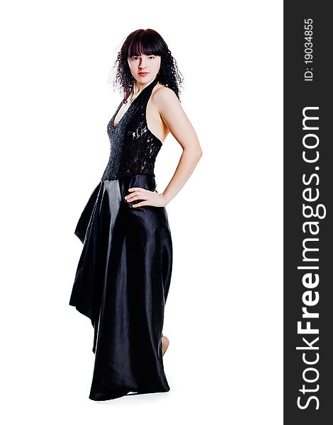 Beautiful woman in long black dress posing. Beautiful woman in long black dress posing