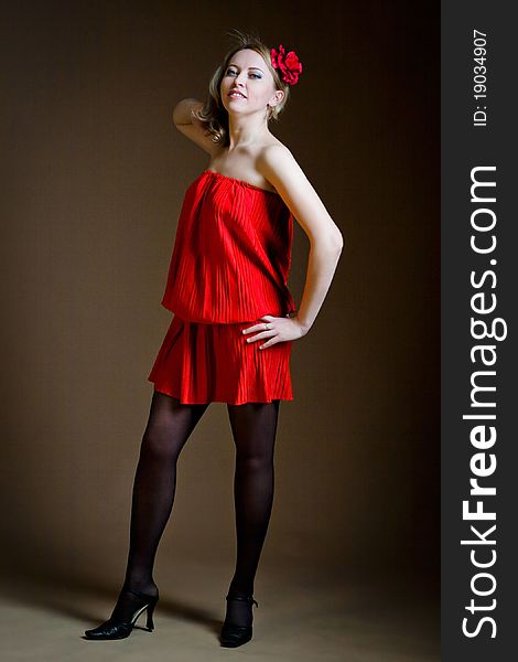 Portrait of attractive woman in red dress