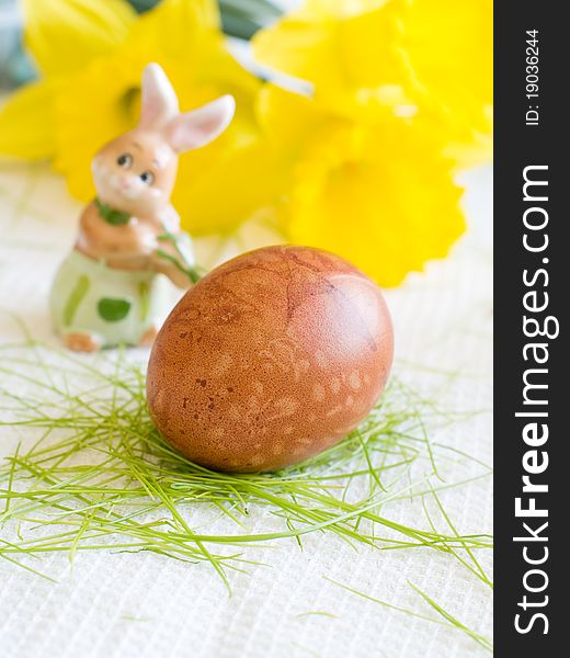 Easter Egg on kitchen towl with flower on background