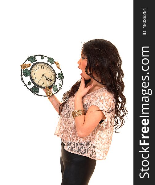 Pretty Asian woman in tights and beige blouse with long curly hair standing with a clock in her hand realizing it is to late, over white. Pretty Asian woman in tights and beige blouse with long curly hair standing with a clock in her hand realizing it is to late, over white.