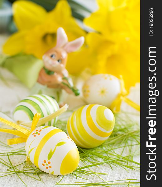 Easter Eggs on kitchen towl with flower on background