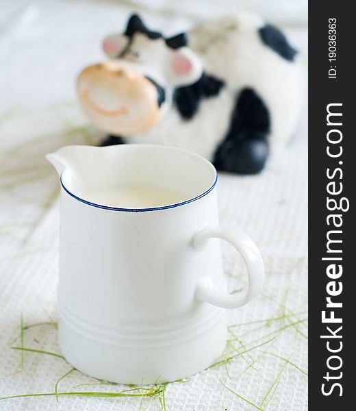 Milk with cow on background