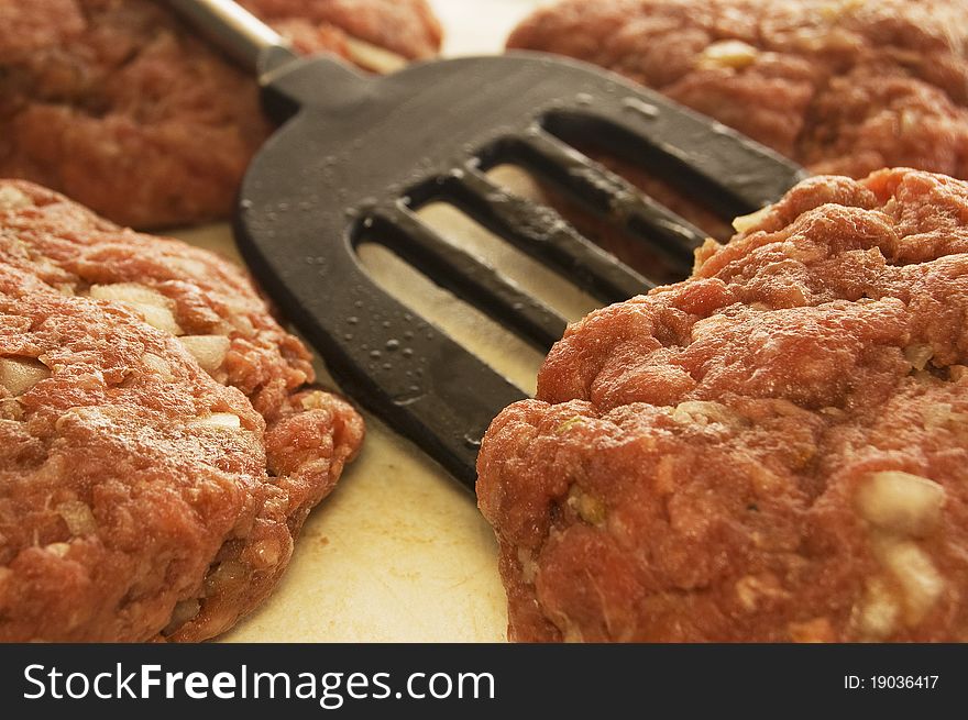 Raw meat patties ready for cooking