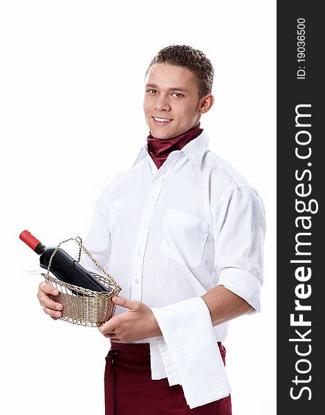 The young waiter with a bottle of wine on a white background. The young waiter with a bottle of wine on a white background