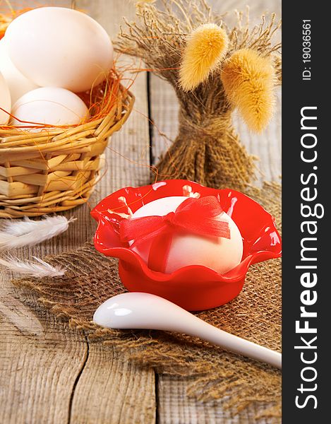 Easter still-life. Egg decorated with ribbon