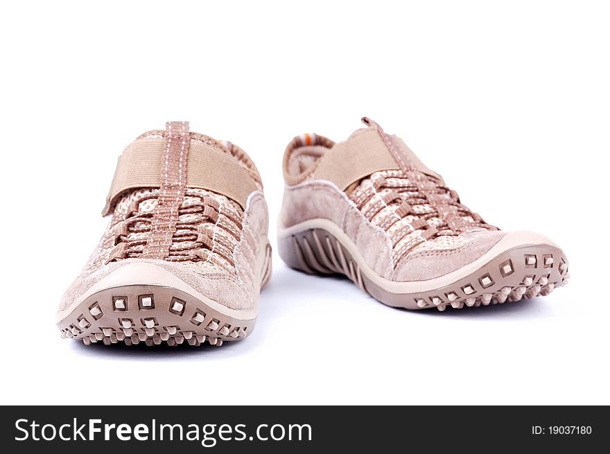 Brown trainers on a white background