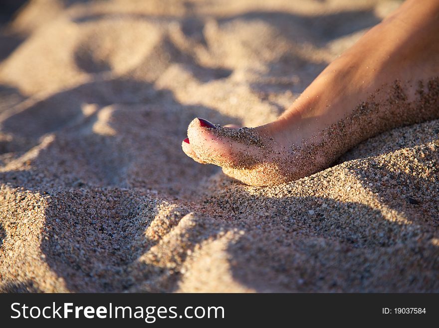 Woman feet on sand at Girona Catalonia Spain. Woman feet on sand at Girona Catalonia Spain