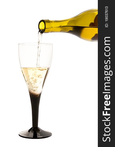 Isolated glass of white wine and the bottle. Isolated glass of white wine and the bottle