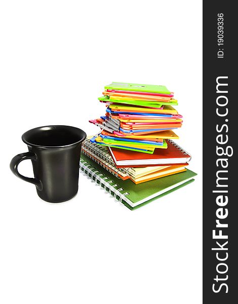 Back coffee cup and note book on white background