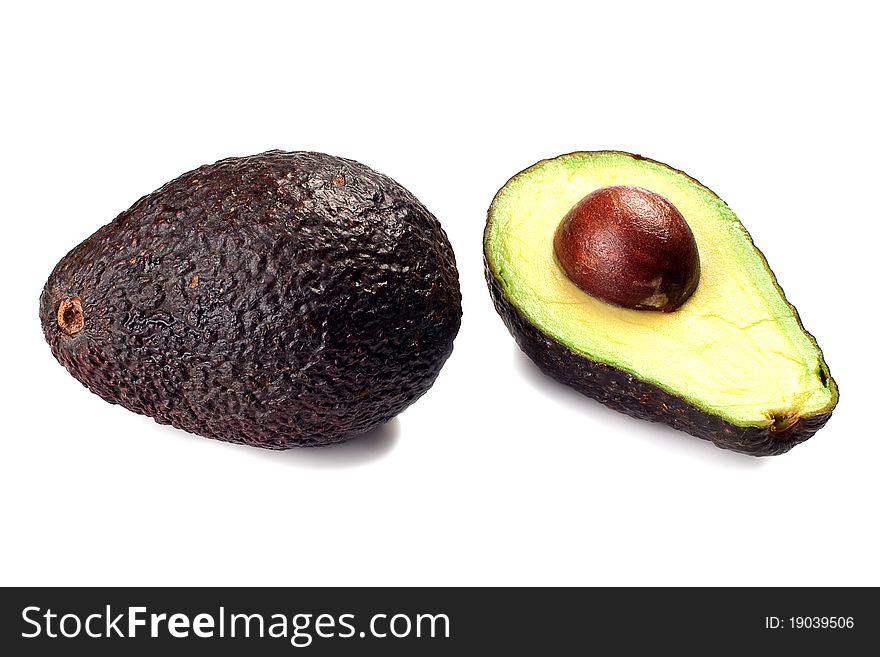 Avocado whole and half isolated on a white background