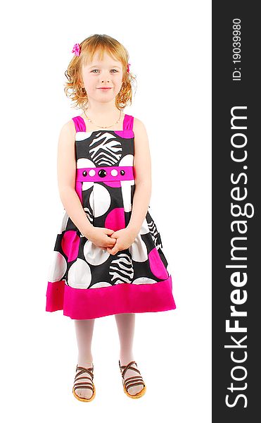 Pretty little girl wearing a pink  and black sumer dress smiling   isolated on white background. Pretty little girl wearing a pink  and black sumer dress smiling   isolated on white background.