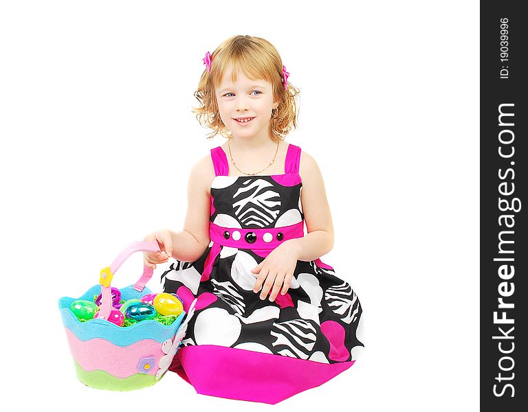 Little girl with Easter eggs in a basket. Little girl with Easter eggs in a basket