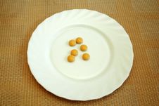 Pills On The White Plate Stock Images