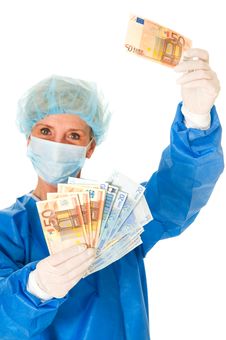 Female Surgeon Holding Banknotes Royalty Free Stock Photos