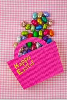 Chocolate Easter Eggs Falling From A Pink Bag Stock Image Chocolate Easter Eggs Falling From A Pink Bag Stock Image