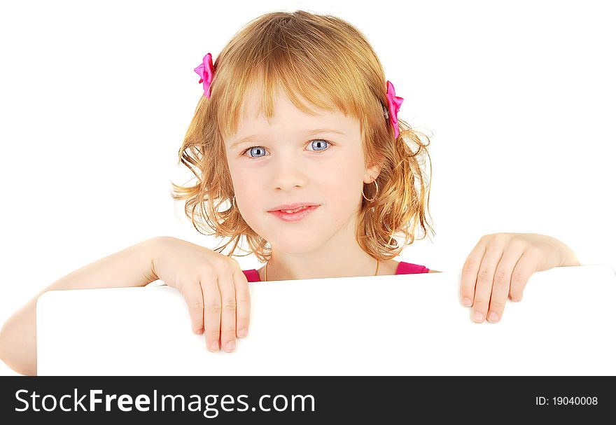Smiling little adorable  girl holding empty white board isolated on the white. Smiling little adorable  girl holding empty white board isolated on the white.