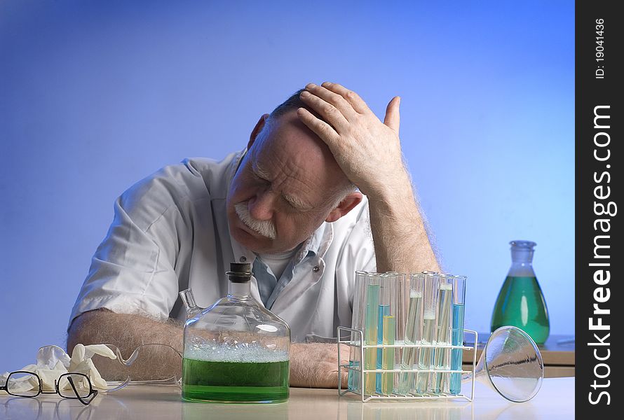 Scientist working witch chemicals having a headache