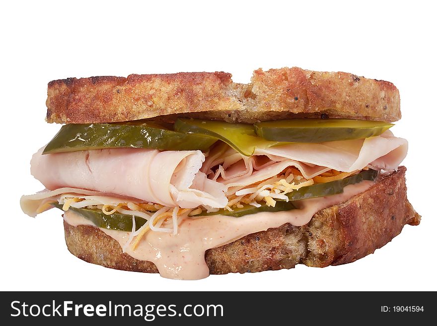 Sandwich with meat, pickles, and cheese isolated on a white background. Sandwich with meat, pickles, and cheese isolated on a white background.