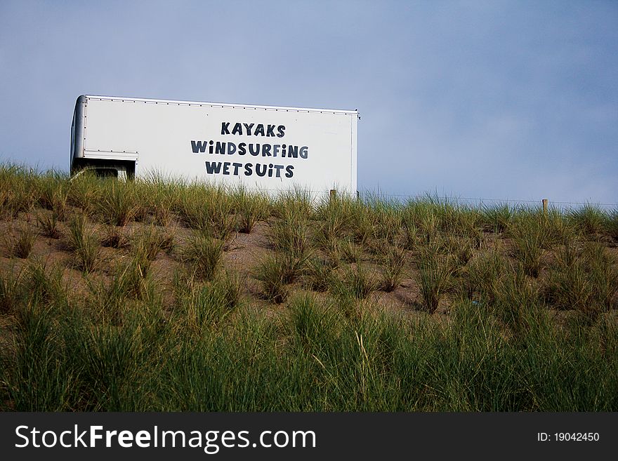 Truck advertising renting for kayaks, windsurfing and wetsuits in a beach in the south west of the UK. Truck advertising renting for kayaks, windsurfing and wetsuits in a beach in the south west of the UK