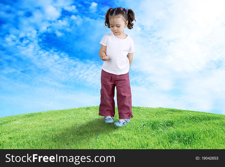 The happy child playing in the field. The happy child playing in the field