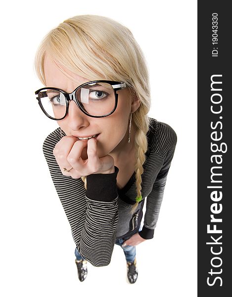 Smart young blond woman with funny glasses and plait looks like nerdy girl. Pose and looking at camera, humor style on white background. Smart young blond woman with funny glasses and plait looks like nerdy girl. Pose and looking at camera, humor style on white background.