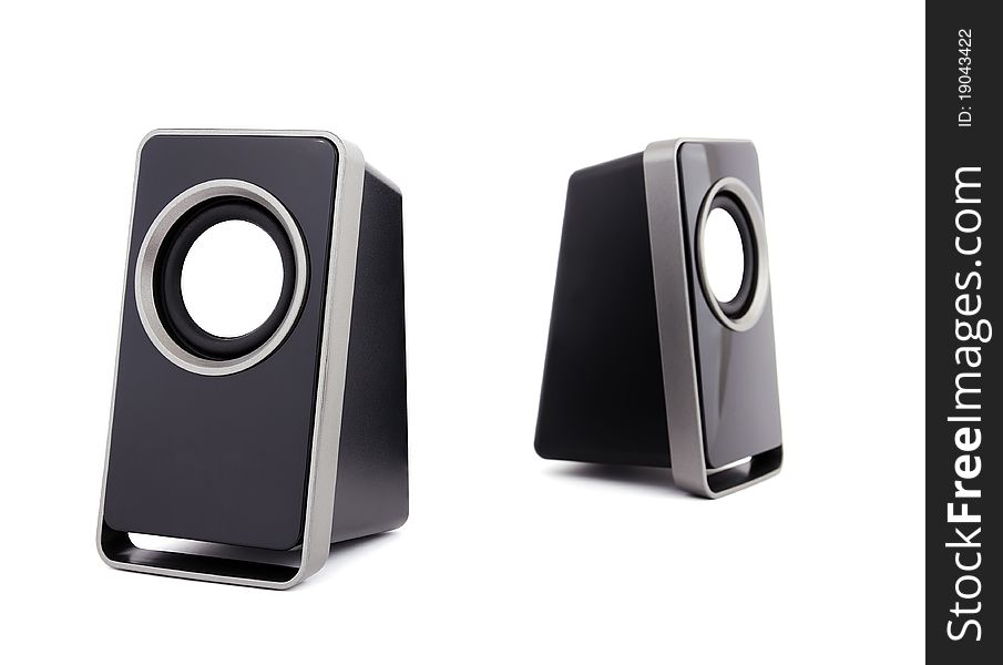 Two computer speakers on a white background